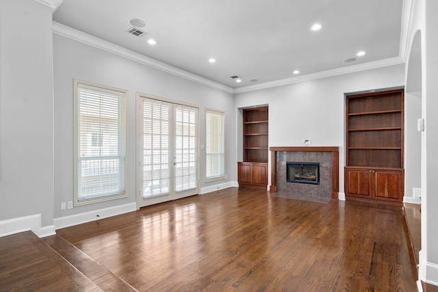 unfurnished living room with a fireplace, baseboards, wood finished floors, and recessed lighting