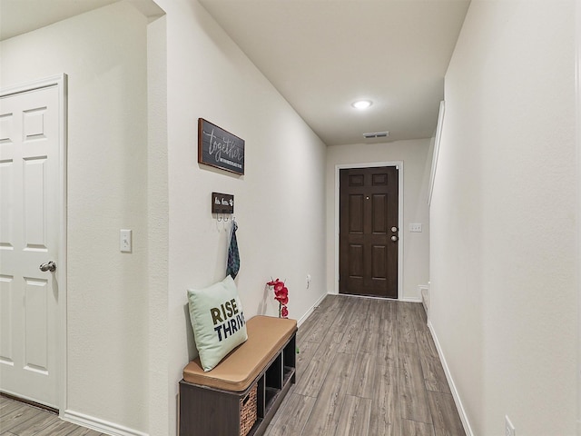 interior space with visible vents, baseboards, and light wood-style flooring