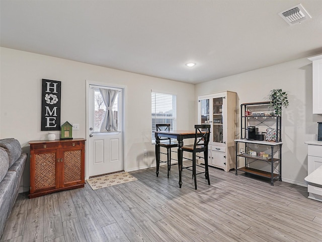 dining area with recessed lighting, visible vents, baseboards, and light wood finished floors