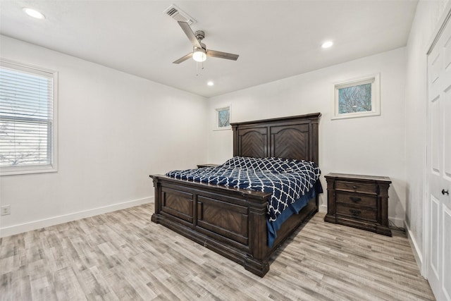 bedroom featuring light wood-style flooring, baseboards, and recessed lighting