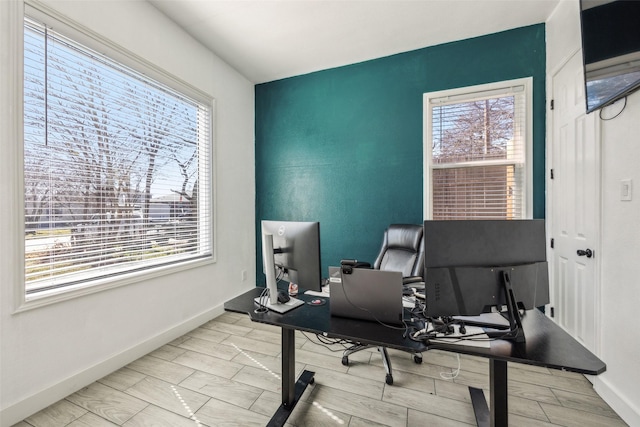 office featuring baseboards and wood finish floors