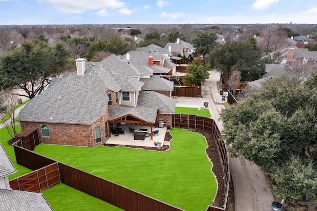 birds eye view of property with a residential view