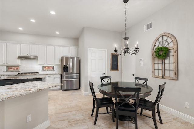 dining space featuring a chandelier, recessed lighting, visible vents, and baseboards