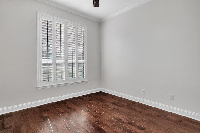 empty room featuring crown molding, dark wood finished floors, baseboards, and a ceiling fan