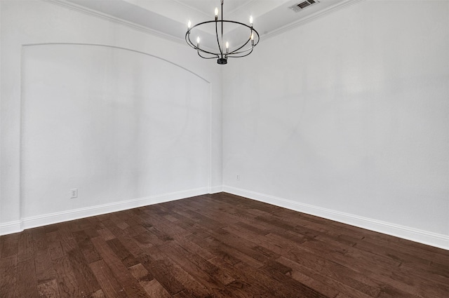 unfurnished dining area with baseboards, visible vents, dark wood finished floors, ornamental molding, and an inviting chandelier