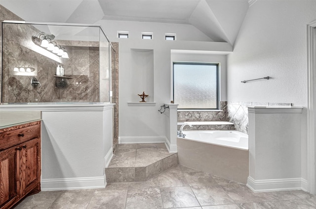 bathroom featuring lofted ceiling, a stall shower, vanity, and a bath