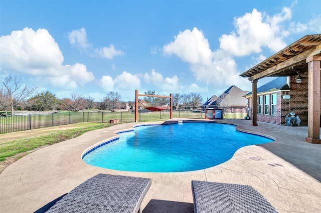 view of swimming pool featuring a patio, a yard, a fenced backyard, and a fenced in pool