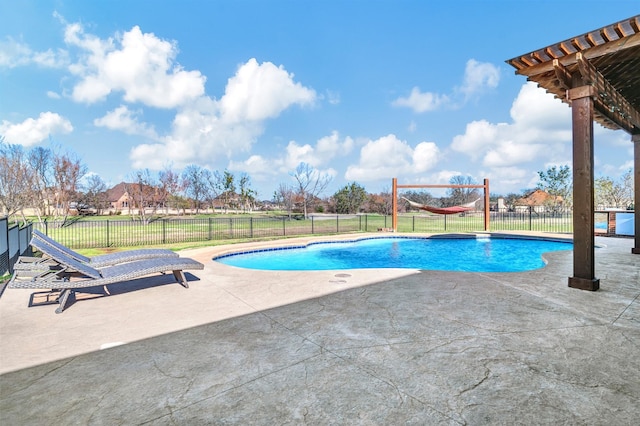 view of pool with a patio, a yard, fence, and a fenced in pool