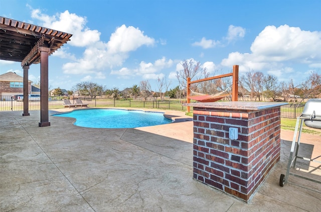 view of pool with a fenced in pool, a patio area, and fence