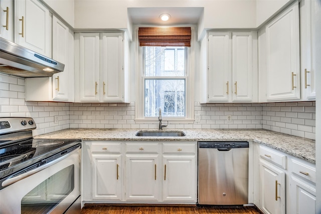 kitchen featuring stainless steel appliances, white cabinets, a sink, and under cabinet range hood