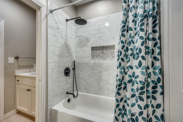 full bathroom with tile patterned floors, vanity, and shower / tub combo with curtain