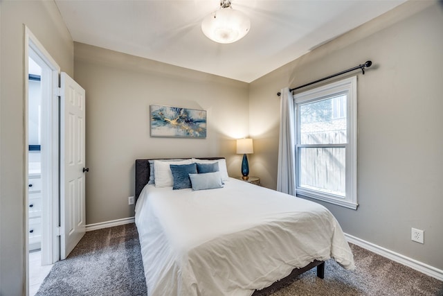 carpeted bedroom with baseboards