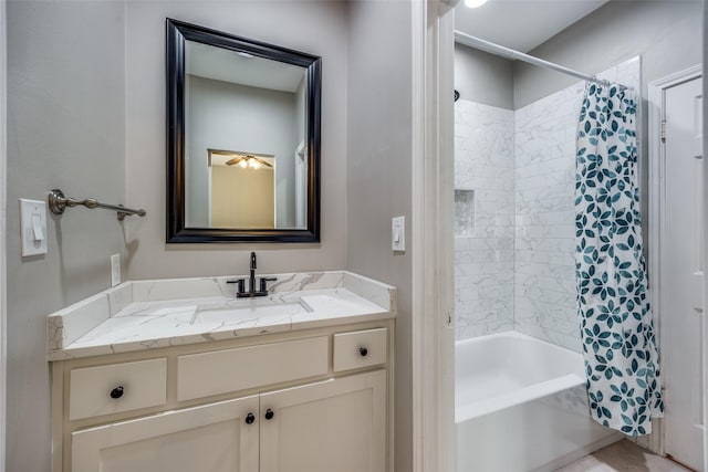 bathroom featuring shower / bath combo and vanity