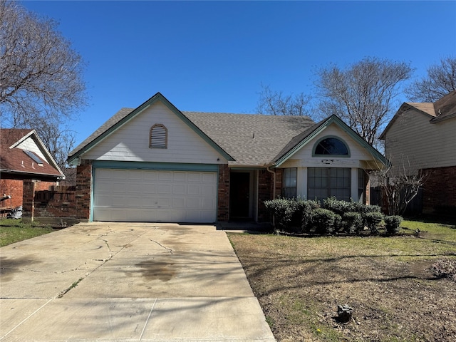 single story home featuring a garage, concrete driveway, brick siding, and roof with shingles