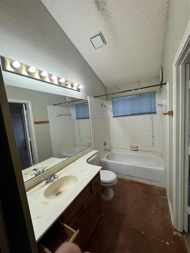 bathroom with a textured ceiling, lofted ceiling, toilet, vanity, and shower / bathing tub combination