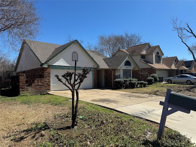 view of front of home featuring concrete driveway, brick siding, and an attached garage