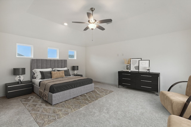 bedroom featuring baseboards, ceiling fan, multiple windows, and light colored carpet