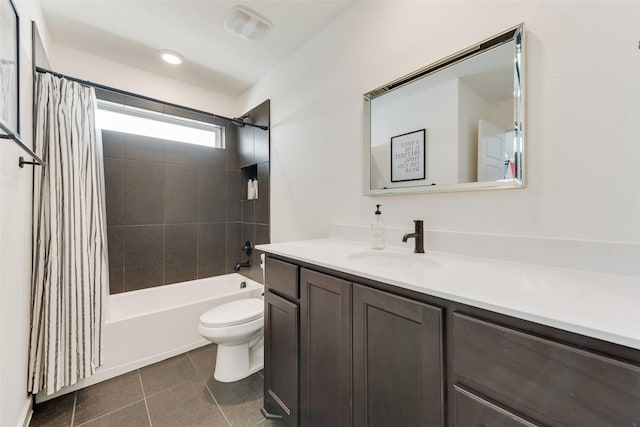 full bath featuring toilet, vanity, visible vents, tile patterned floors, and shower / bath combo