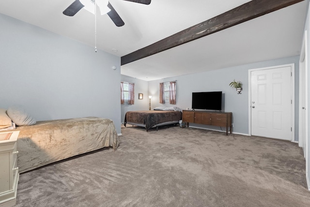 bedroom with carpet floors, beam ceiling, and a ceiling fan