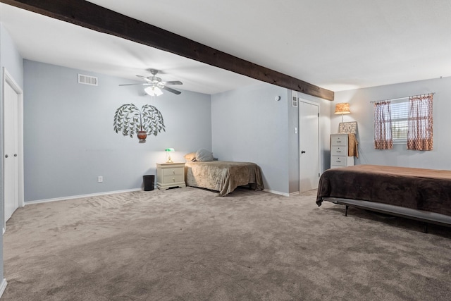 bedroom featuring carpet floors, baseboards, visible vents, and beam ceiling