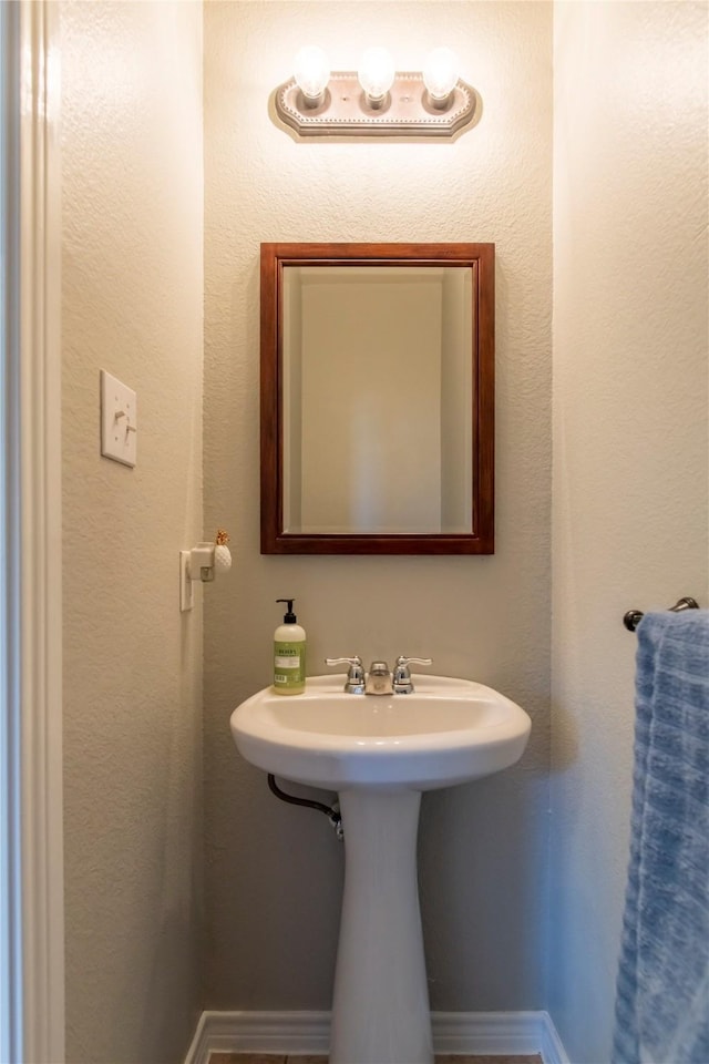 bathroom featuring baseboards