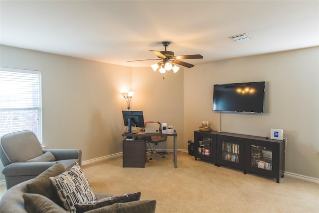 home office with carpet flooring, baseboards, visible vents, and ceiling fan