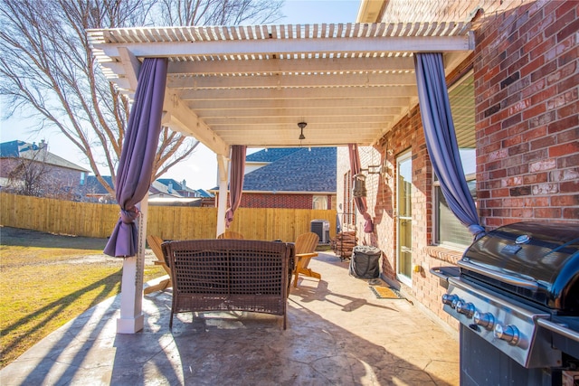 view of patio with a grill, a pergola, and fence