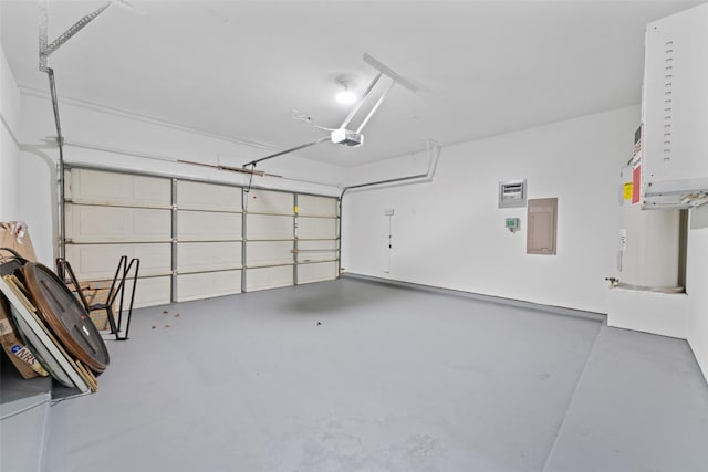 garage featuring electric panel and a garage door opener