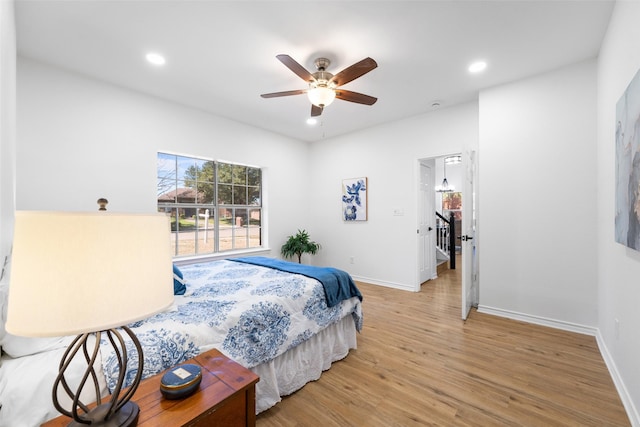 bedroom featuring light wood-type flooring, baseboards, and recessed lighting