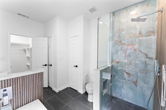 bathroom featuring a shower stall and visible vents