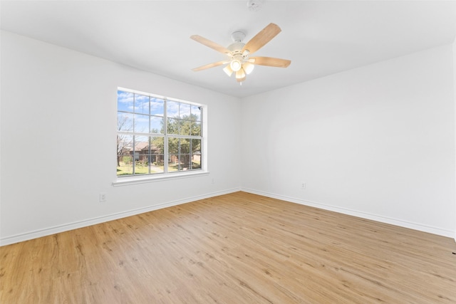 unfurnished room with light wood-style flooring, baseboards, and ceiling fan