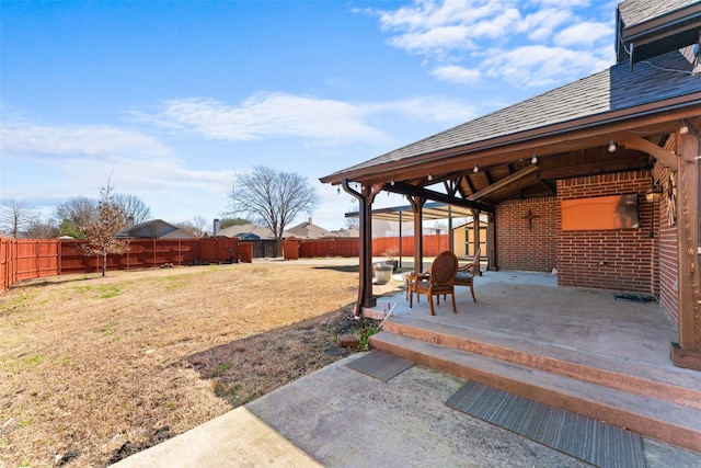 view of yard with a fenced backyard and a patio