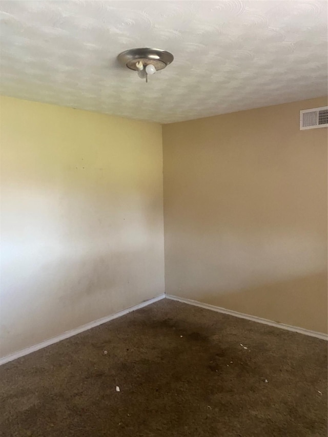 spare room with visible vents and baseboards