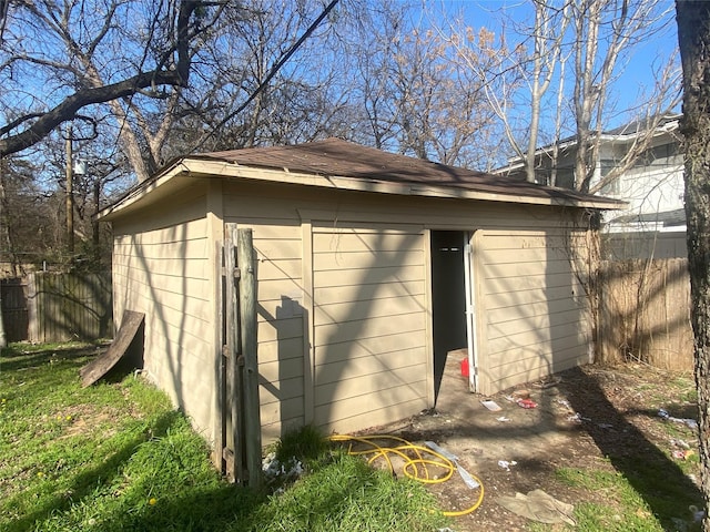 view of outbuilding with an outbuilding and fence