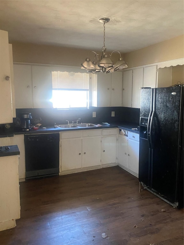 kitchen with dark countertops, black appliances, white cabinetry, and dark wood-style flooring