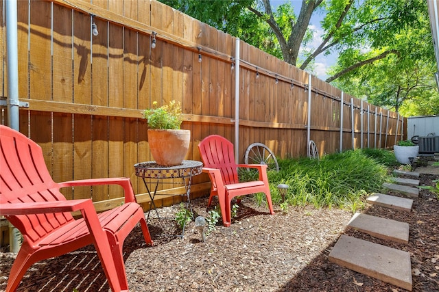 view of patio / terrace with fence and central air condition unit