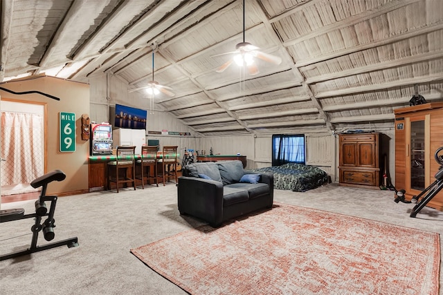 carpeted living area with lofted ceiling and a ceiling fan