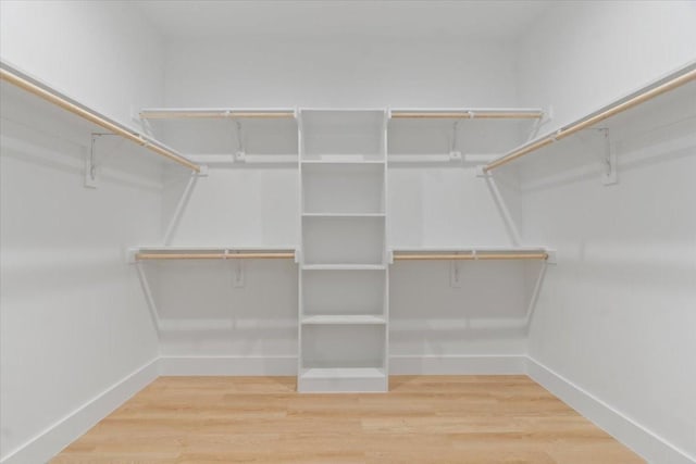 spacious closet with wood finished floors