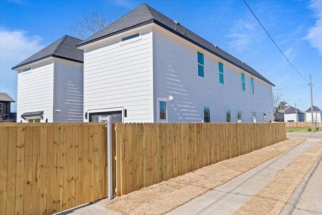 view of property exterior with fence