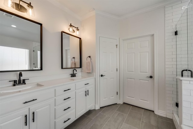 full bathroom with crown molding, a stall shower, visible vents, and a sink