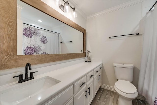 bathroom with crown molding, curtained shower, toilet, vanity, and baseboards