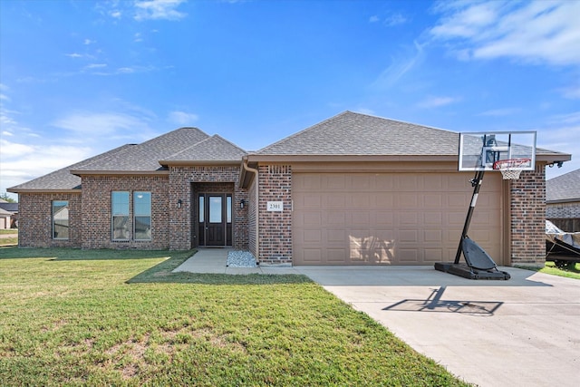 view of front of home with a garage, brick siding, a shingled roof, driveway, and a front lawn