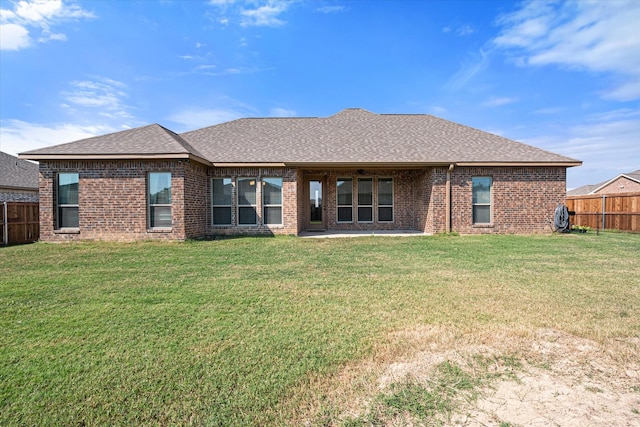 2301 Camryn Ln, Mabank, TX 75147 - back of house with brick siding, a shingled roof, and a patio area