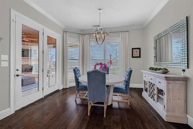 dining space with a notable chandelier, wood finished floors, visible vents, and ornamental molding