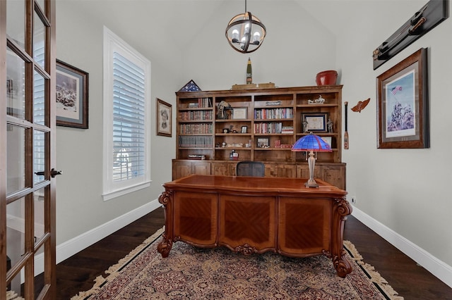 office featuring baseboards, lofted ceiling, an inviting chandelier, and dark wood finished floors