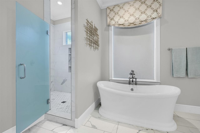 full bathroom featuring a shower stall, a freestanding tub, baseboards, and marble finish floor