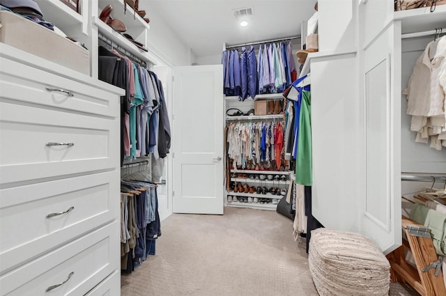 spacious closet with visible vents and light carpet