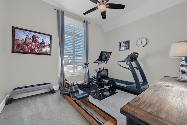 exercise room featuring carpet flooring, baseboards, lofted ceiling, and a ceiling fan