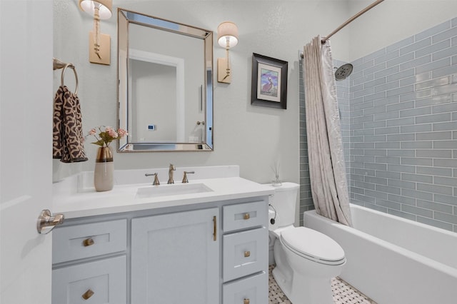 bathroom with vanity, toilet, and shower / bath combo