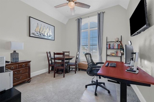 home office with baseboards, ceiling fan, carpet flooring, and vaulted ceiling